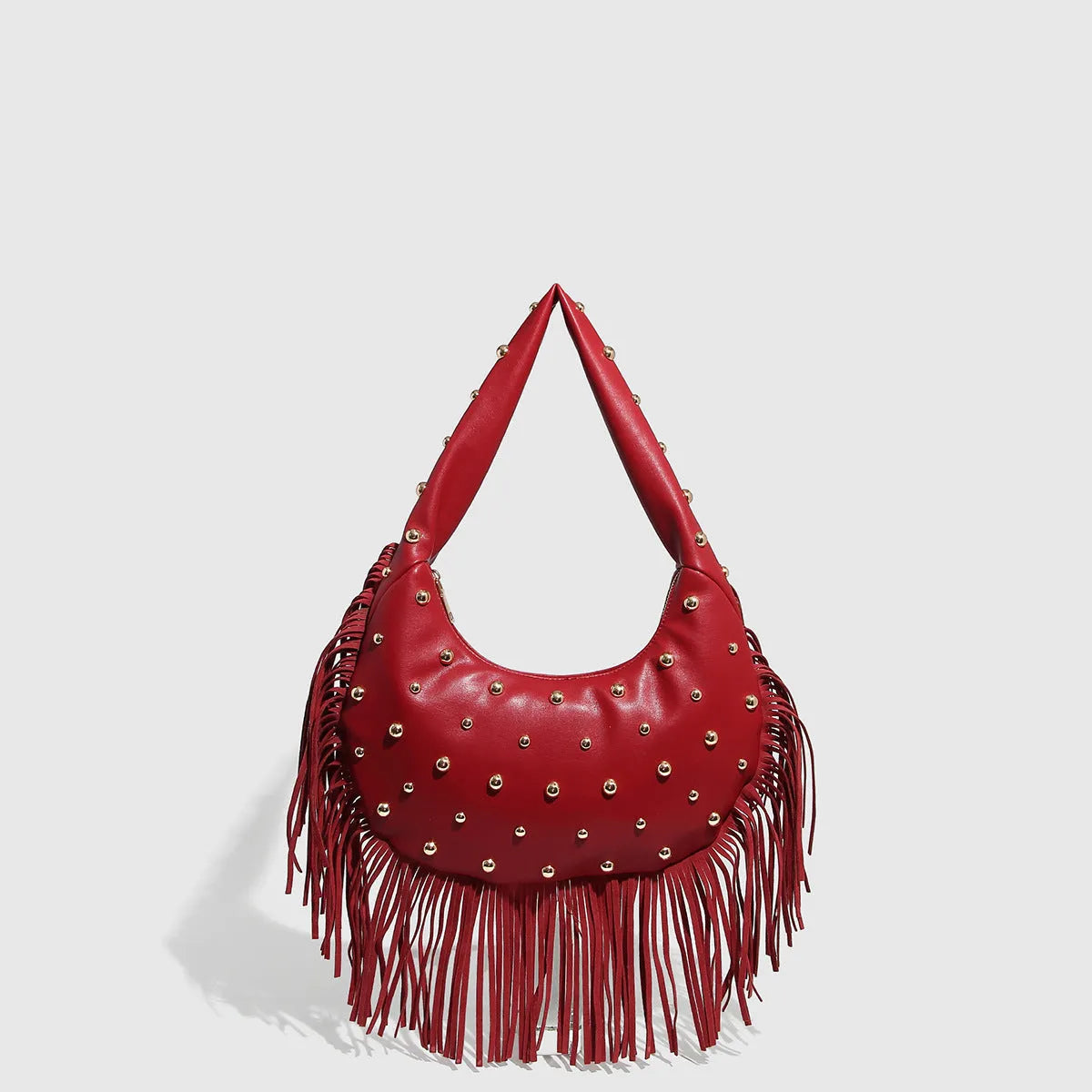 Retro-style black tassel shoulder handbag showing structured shape and decorative tassel.
