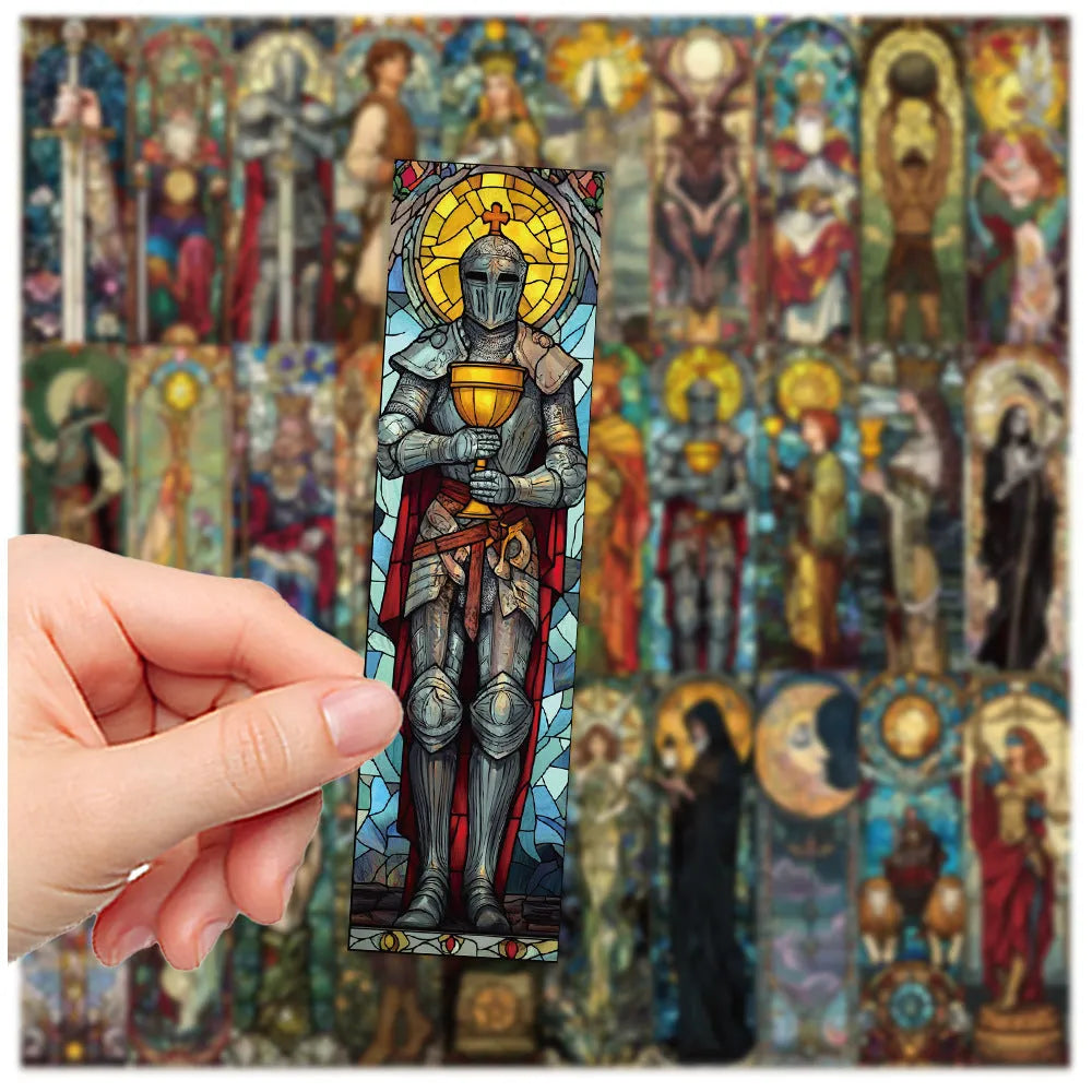 Set of 30 colourful painted glass tarot design paper bookmarks laid out flat.