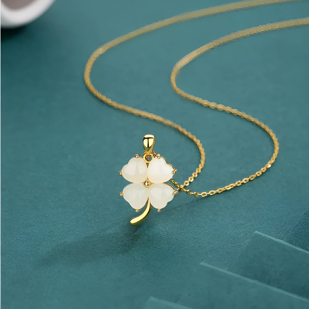 Women's four-leaf clover necklace with Hetian jade pendant on an adjustable sterling silver chain.