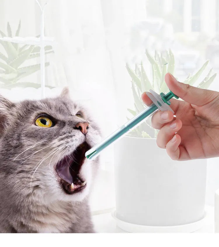 Two pet pill shooters with soft silicone tips, measuring 15cm and 11.5cm, for administering medication to cats and dogs