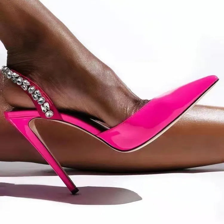 Women's black patent leather pointed toe high heel sandals with rhinestone decoration on the side.