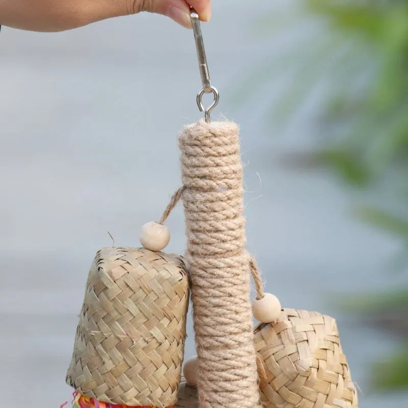 Shredded paper bird toy with colourful paper strips on wooden frame with sisal rope, measuring 15 by 35cm