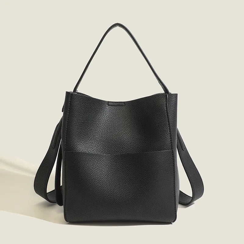 Bucket-style PU messenger bag with sewing line detail, available in black, brown, and elephant gray, on a plain background
