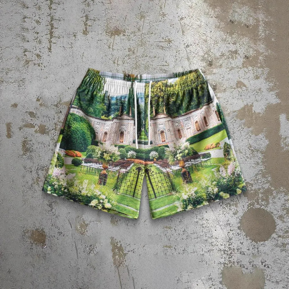 Man wearing loose blue digital print beach shorts made from quick-dry milk silk polyester fabric.