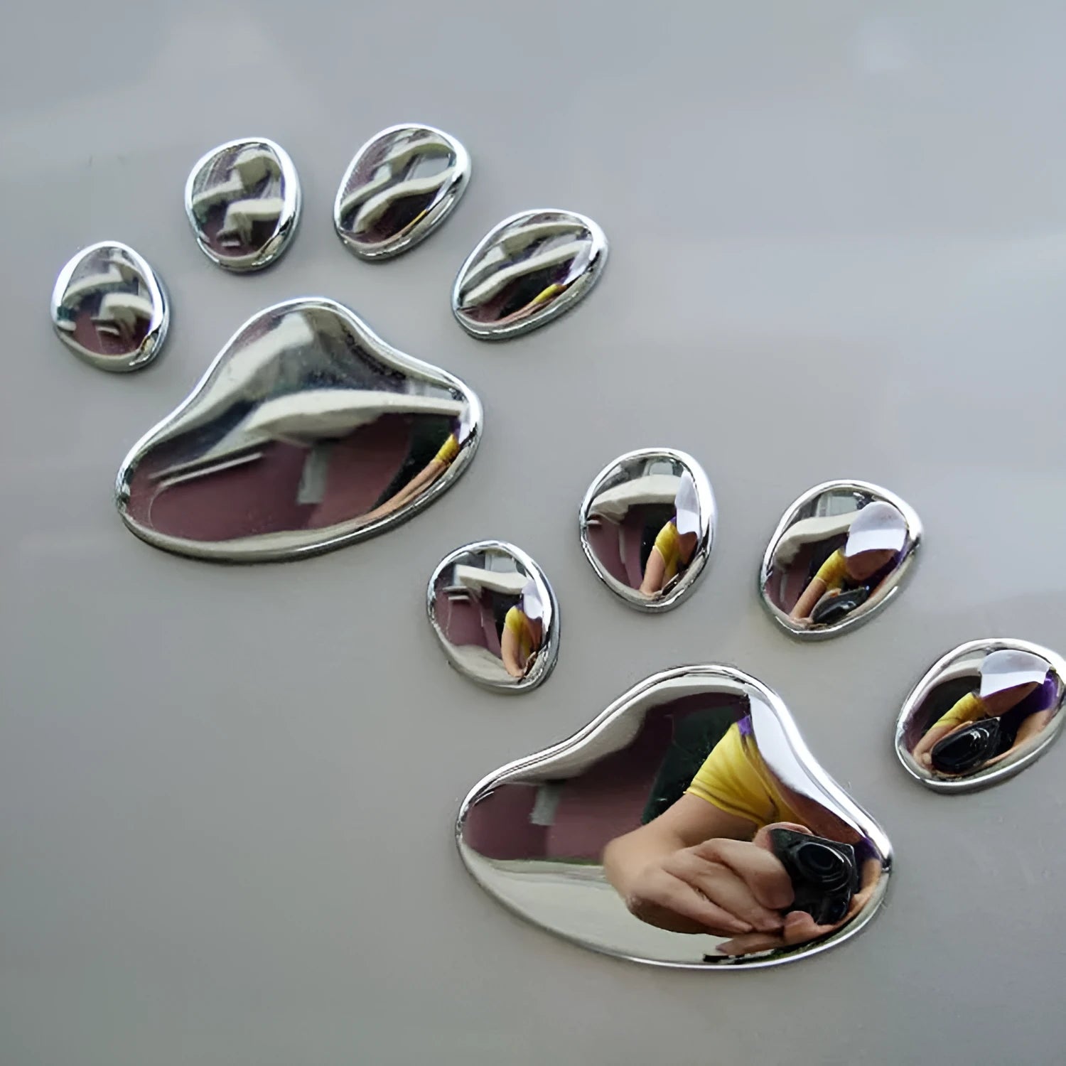 PVC car sticker with hand-shaped brush design showing dog footprints pattern measuring 7 cm length