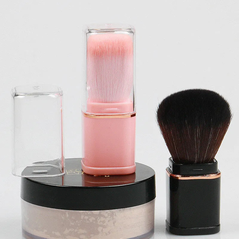 Portable retractable makeup brush with black telescopic handle and artificial fibre bristles for powder blusher application