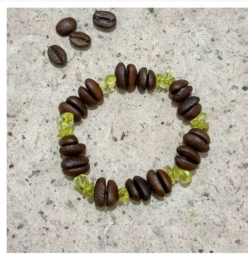 Handmade coffee bean bracelet with 16mm geometric charm showing colour variations