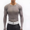 Black slim-fit women's pullover top with a mesh see-through texture and long sleeves.
