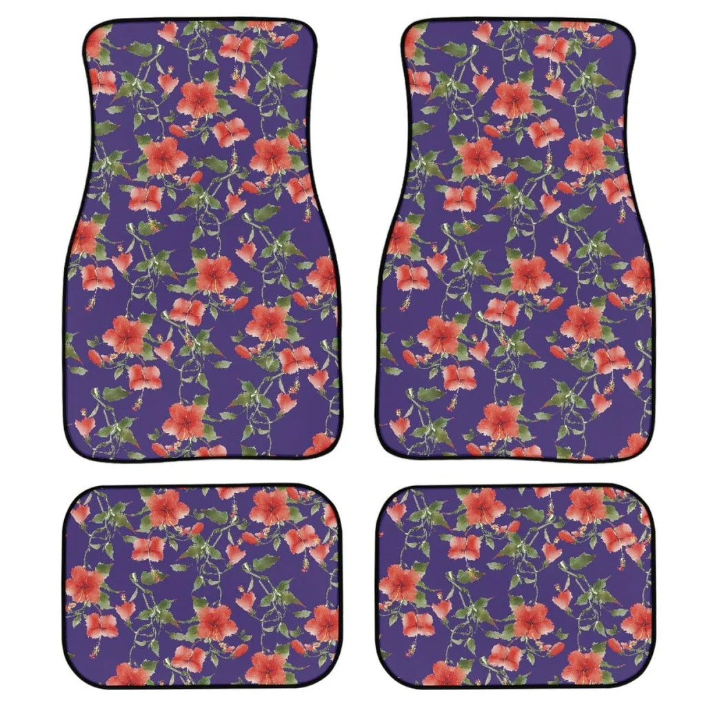 Set of four black rubber car floor mats with a textured surface, shown in a vehicle footwell.