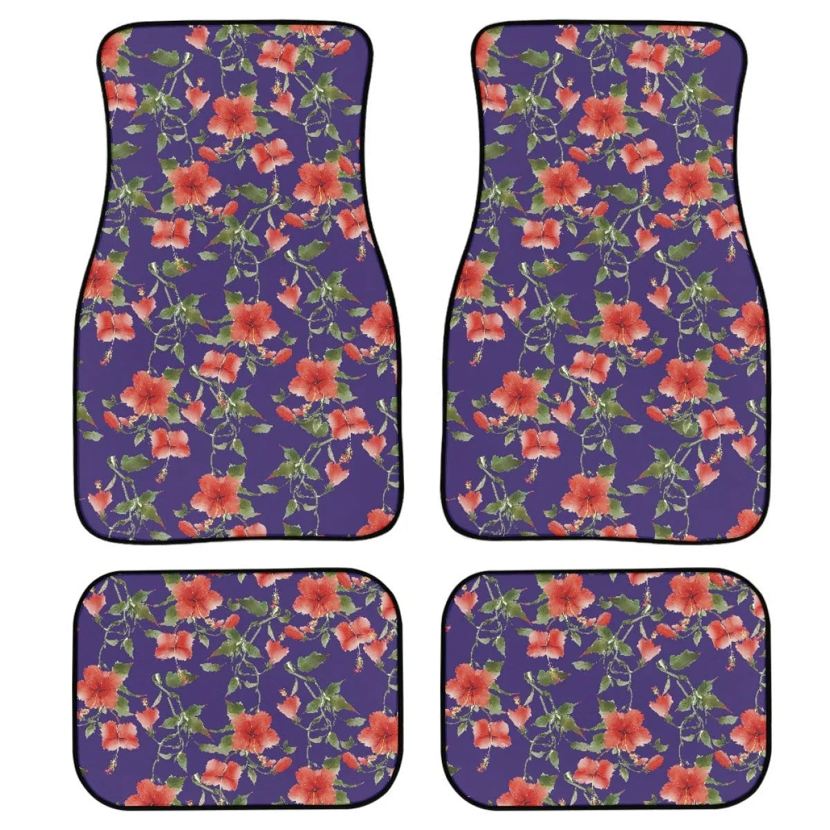 Set of four black rubber car floor mats with a textured surface, shown in a vehicle footwell.