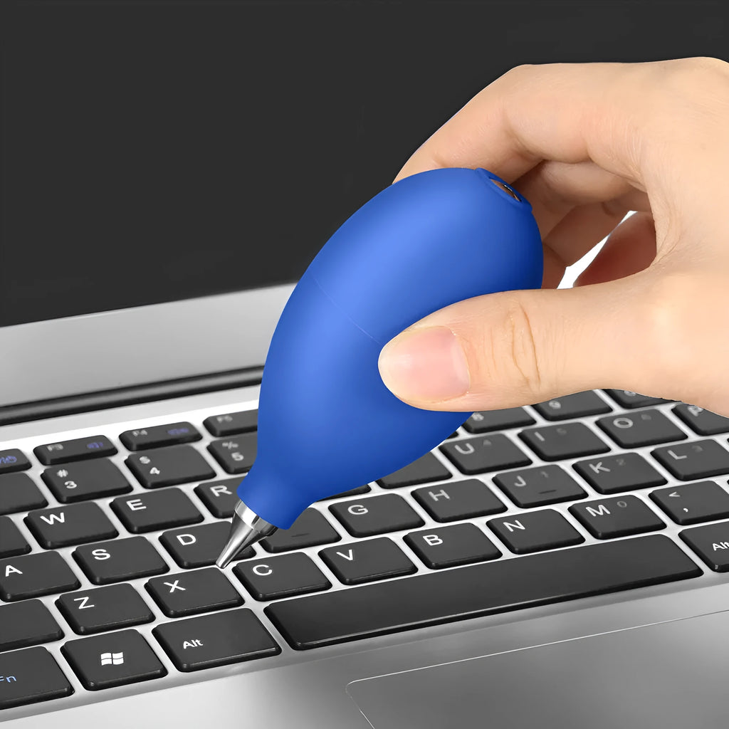 Blue handheld rubber air blower dust removal tool for cleaning camera lenses and phone screens.