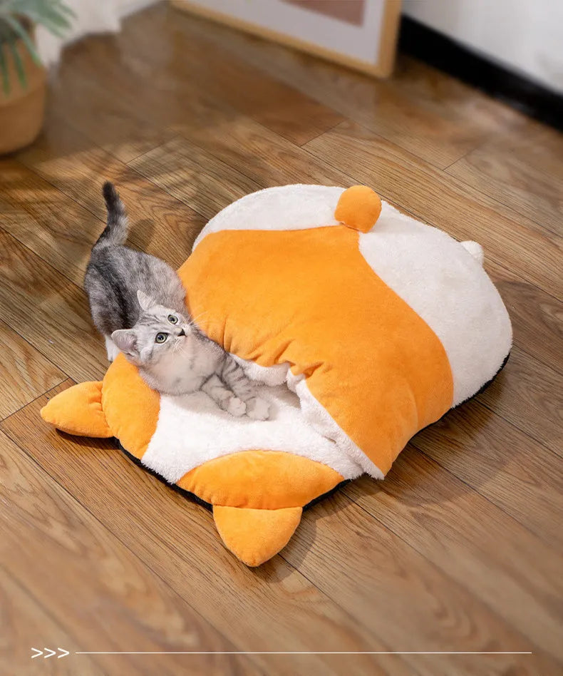 Orange semi-closed cat sleeping bag bed showing soft nest construction and raised edges.