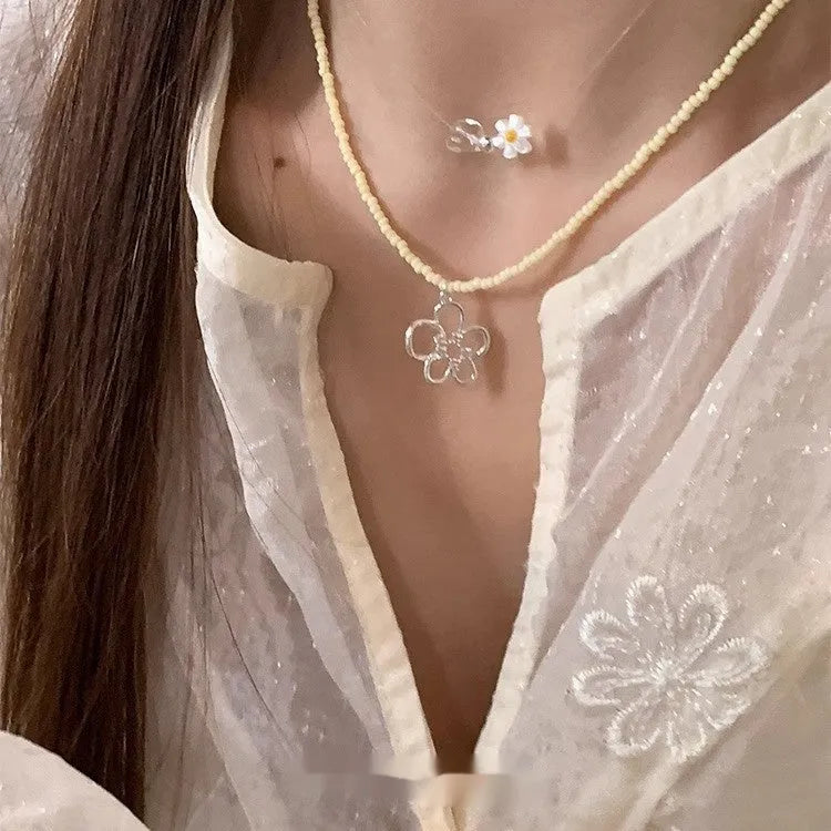 Korean style women's copper necklace with beaded hollow flower pendant and electroplated finish