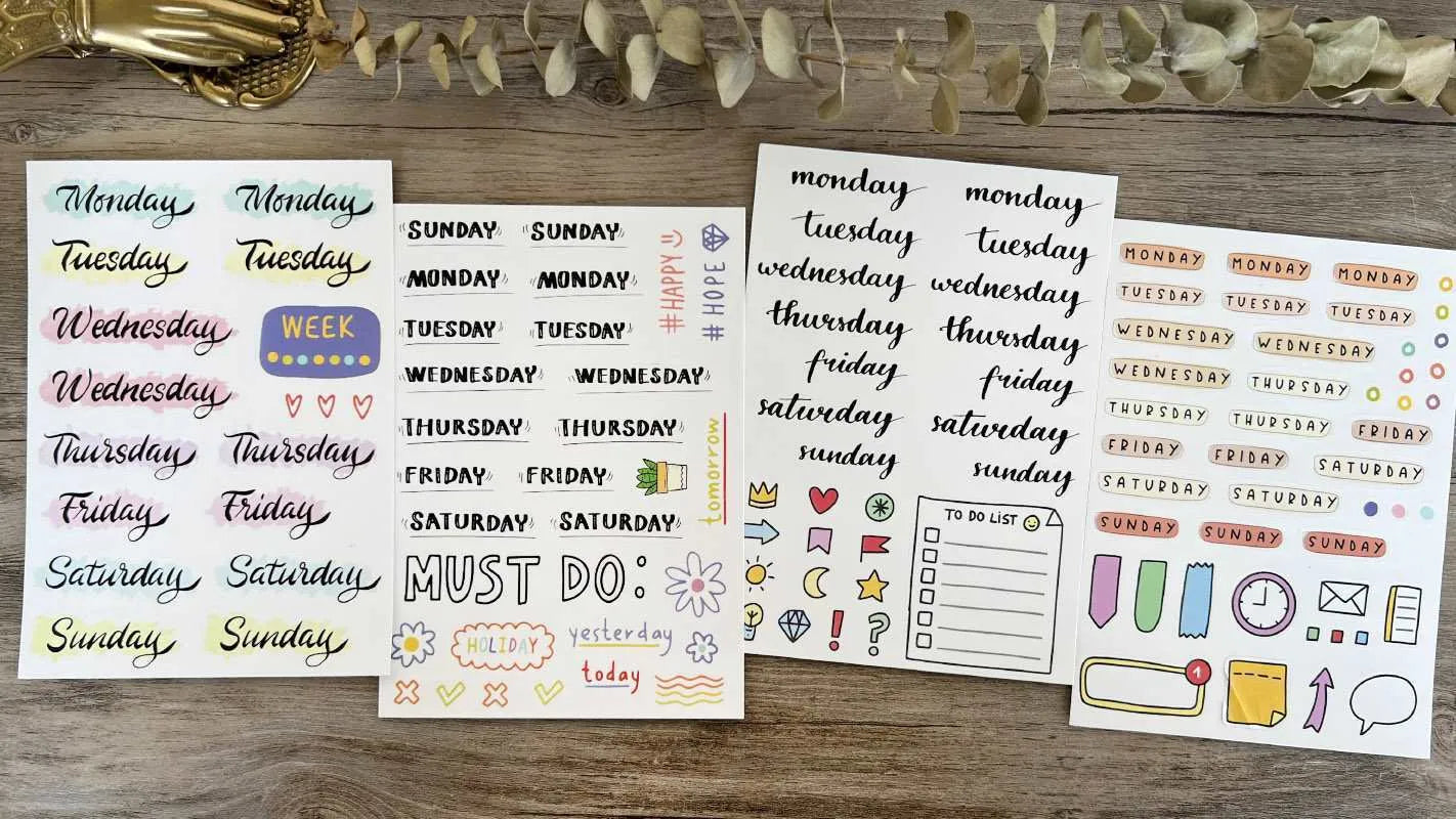 Pack of printed decorative stickers showing English letters, numbers, symbols, and weekly words in a cute style.