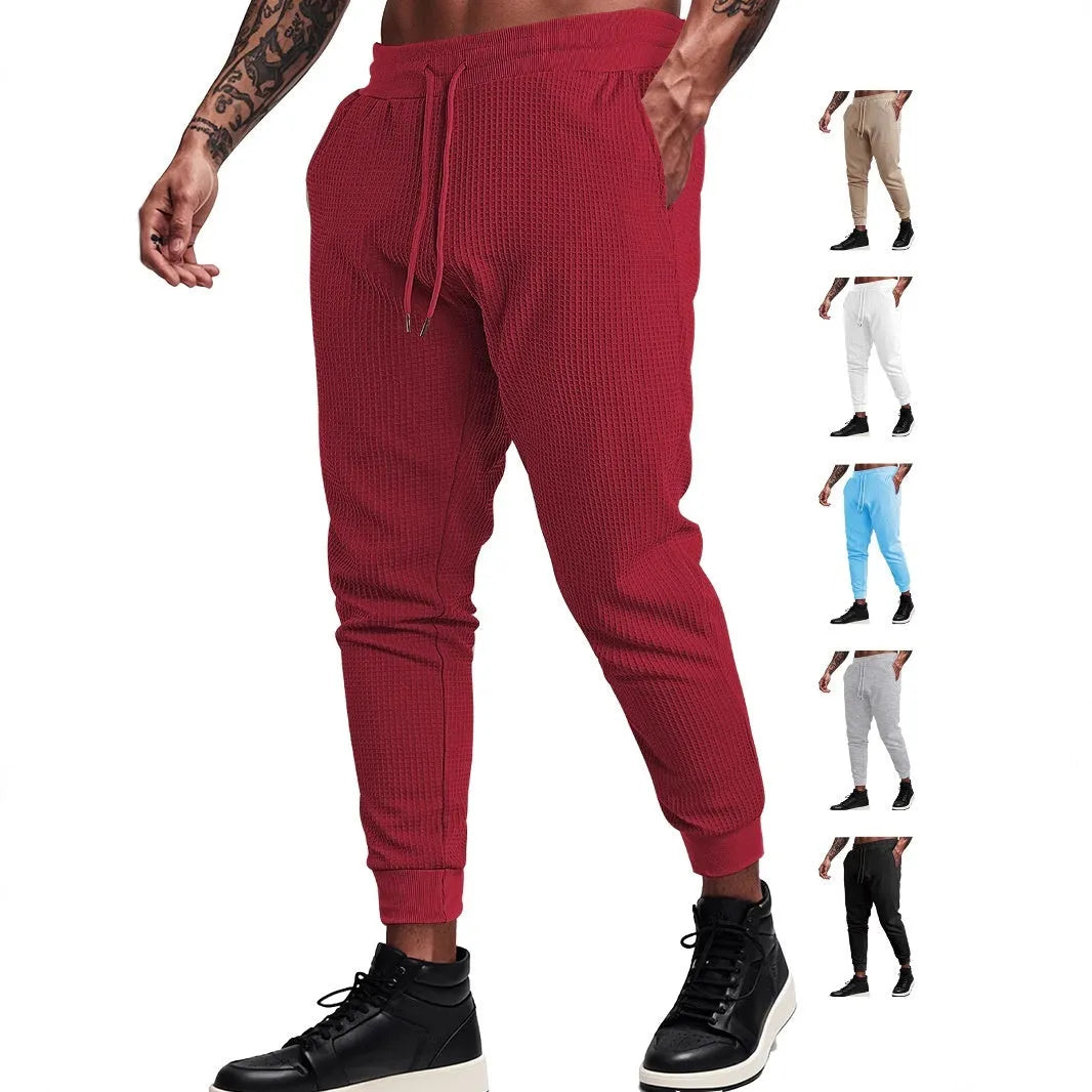 Men's casual loose solid colour waffle knit drawstring pants in khaki, front view, on white background
