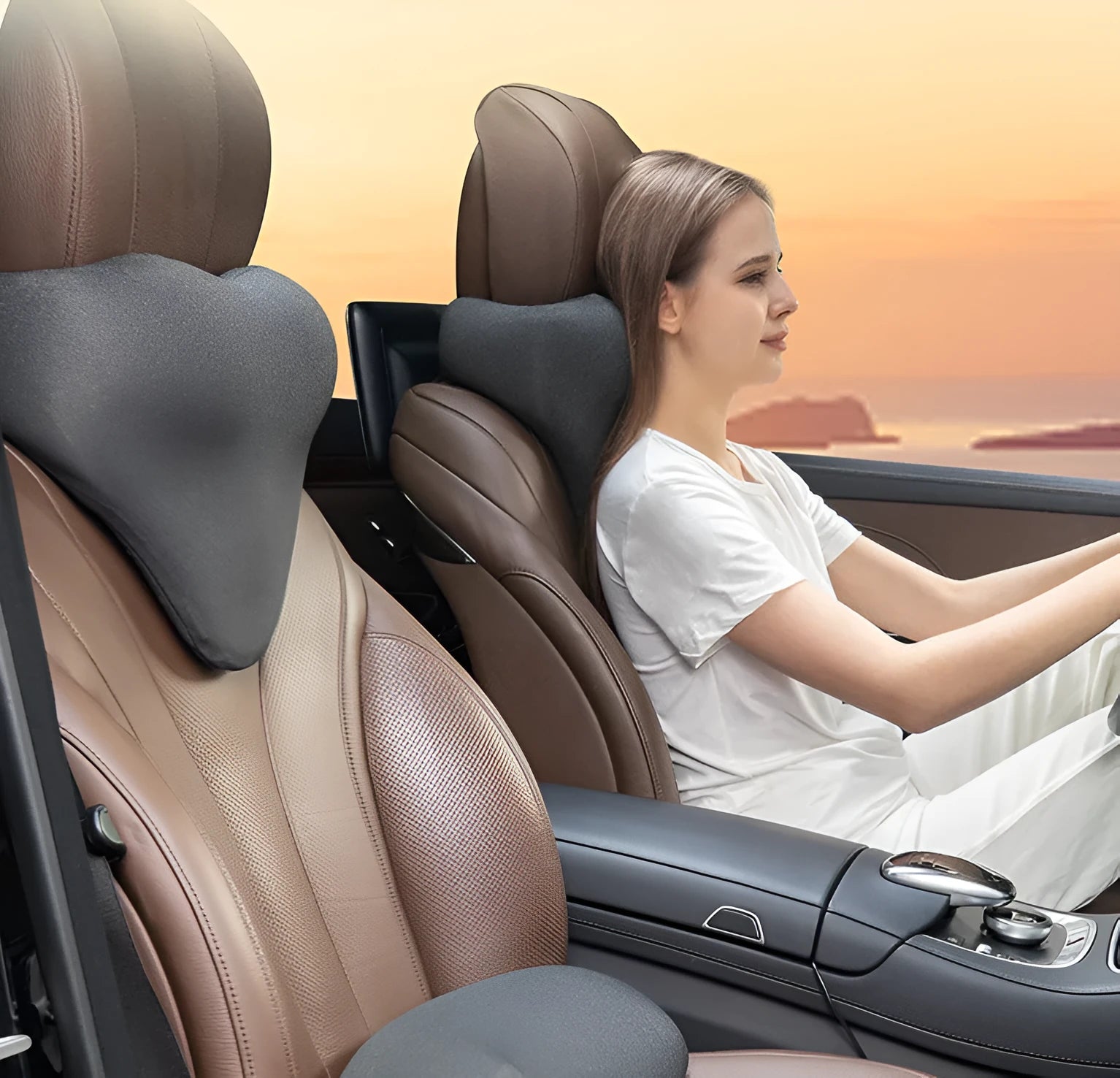 Solid-colour car neck memory pillow in dark grey, shown on a car headrest.