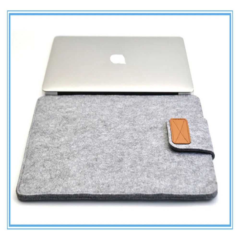 Vertical clamshell laptop bag in grey with plush felt interior and waterproof polyester exterior