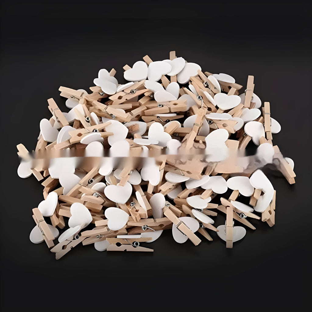 Set of five handmade solid wood heart-shaped clips in red, pink, white, yellow, and rose colours.