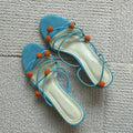 Cyan genuine leather women's sandals with lace-up straps, open toe, and a niche ball high heel.