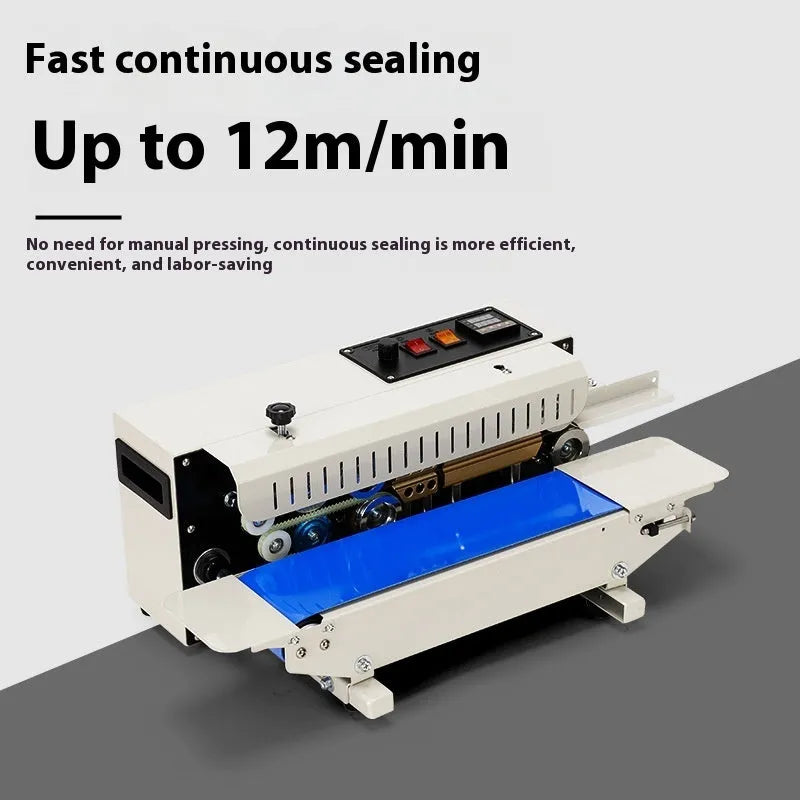Compact manual sealing machine with date stamp on steel head, placed on a kitchen worktop.
