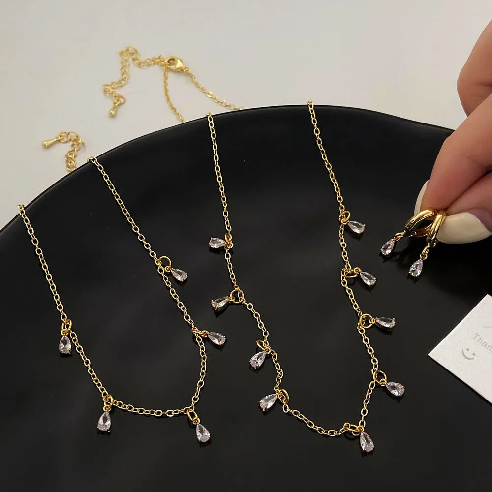 Zircon necklace, earrings, and anklet set with geometric meteor shower design.