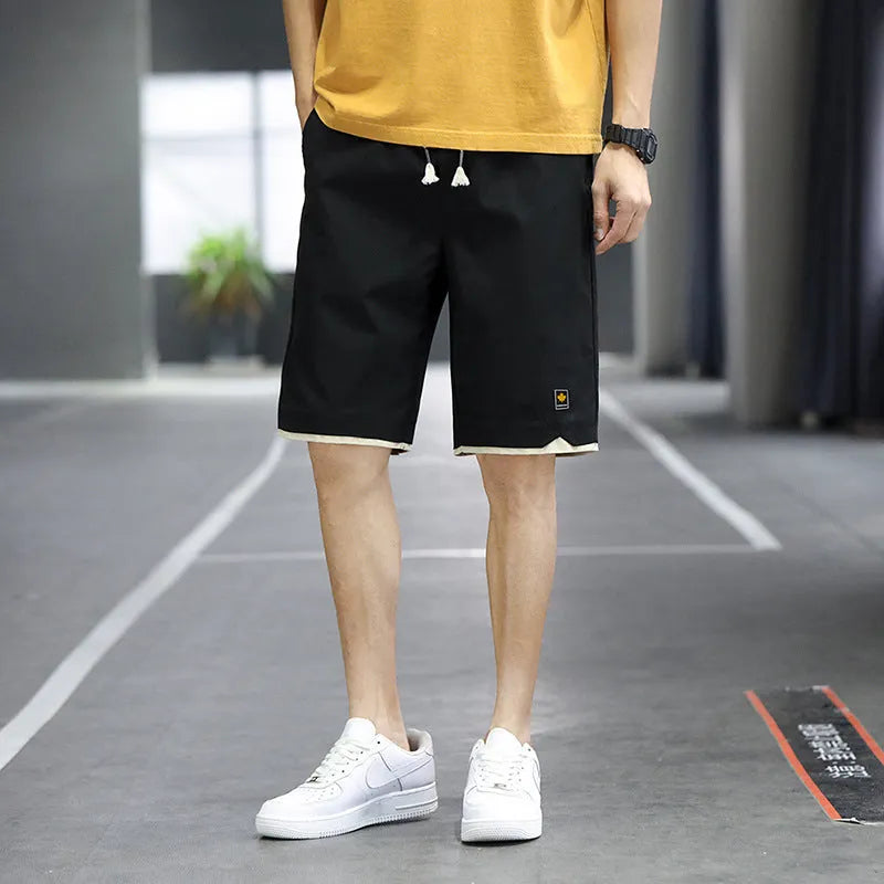 Casual polyester beach shorts with micro elasticity in Korean loose style, available in green, black, khaki and blue colours