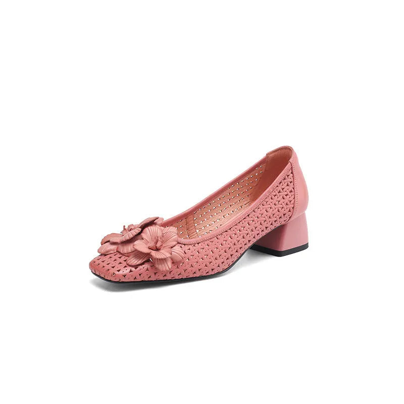 Women's light brown cowhide leather open weave pumps with a mid heel on a neutral background.