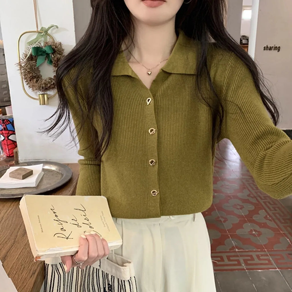 Women's long-sleeved loose fit viscose cardigan top in beige, shown as a layering piece.
