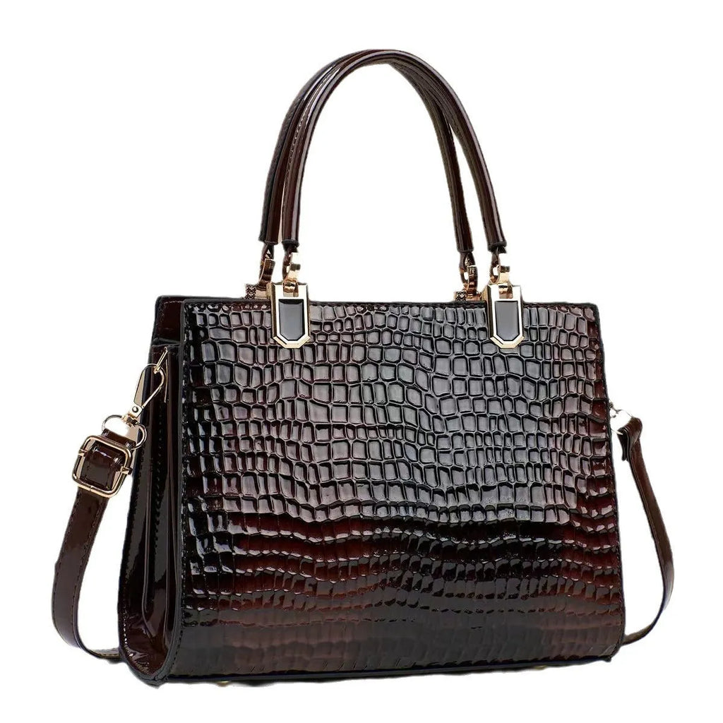 Soft PU leather one shoulder mum bag in a horizontal square shape, shown in a neutral colour with visible internal zip pockets.