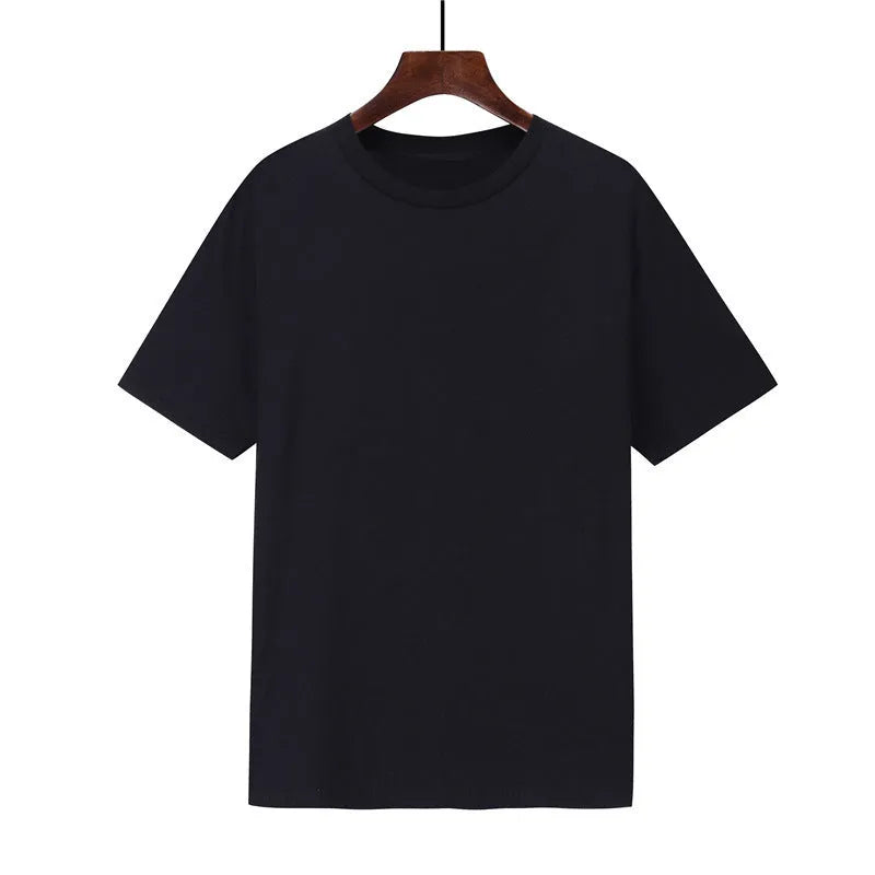 A man's loose-fitting black cotton T-shirt with short sleeves, laid flat.