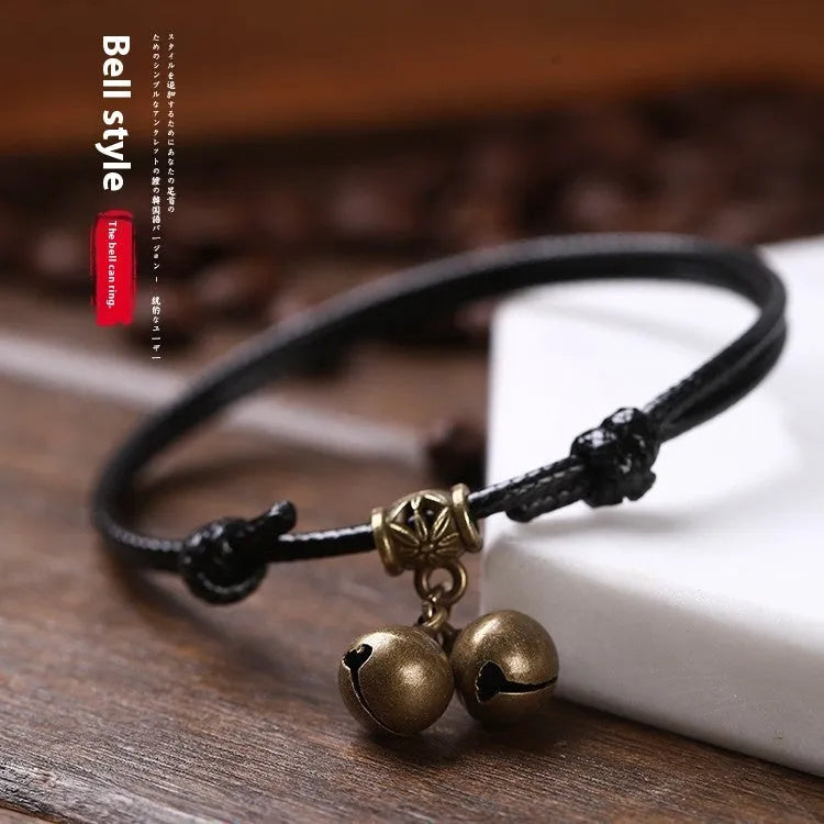 Nylon rope dog collar with brass bell shown in black, red, and coffee colours.