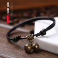 Nylon rope dog collar with brass bell shown in black, red, and coffee colours.