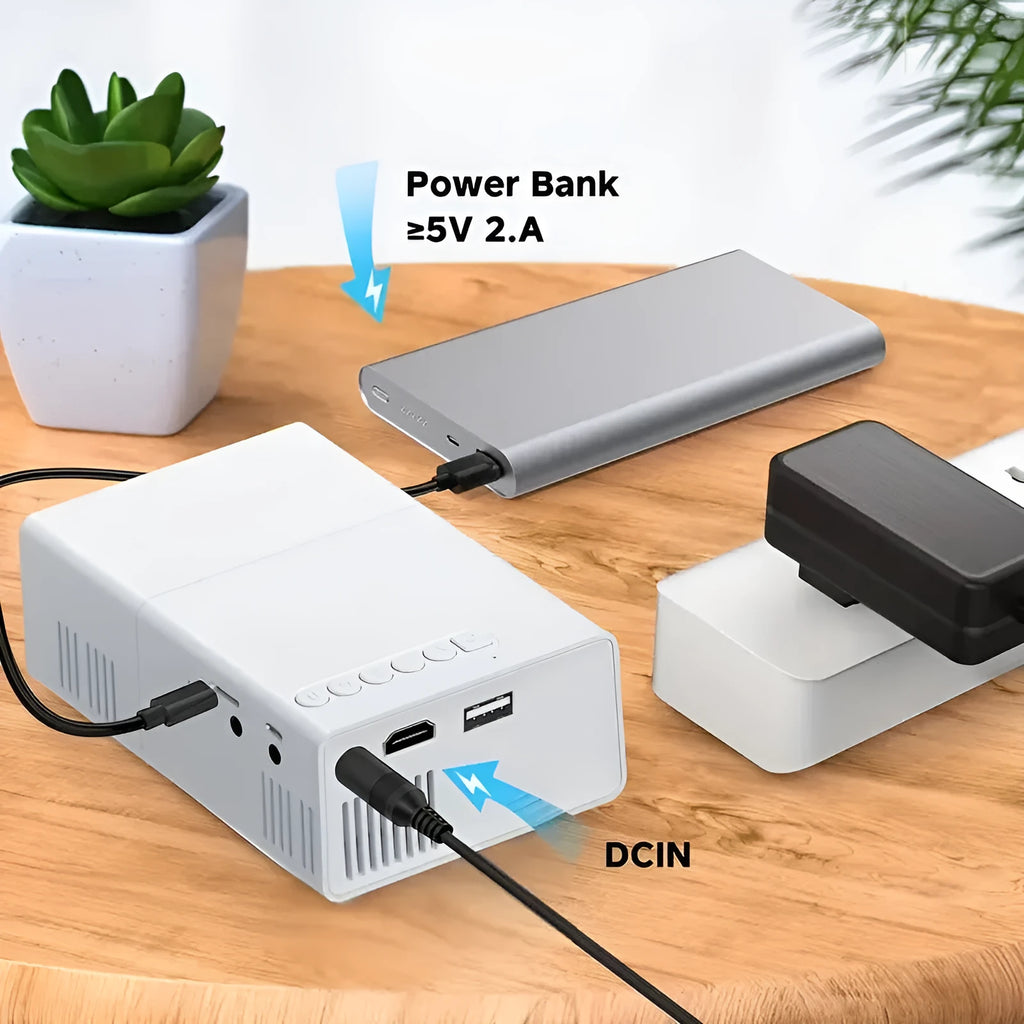 Compact white M100 mini LED home projector with remote control on a table.