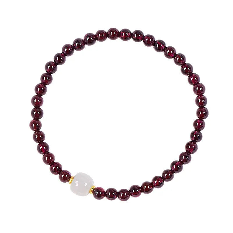 Women's garnet bracelet with U-shaped design and polished stones in 4mm or 6mm diameters