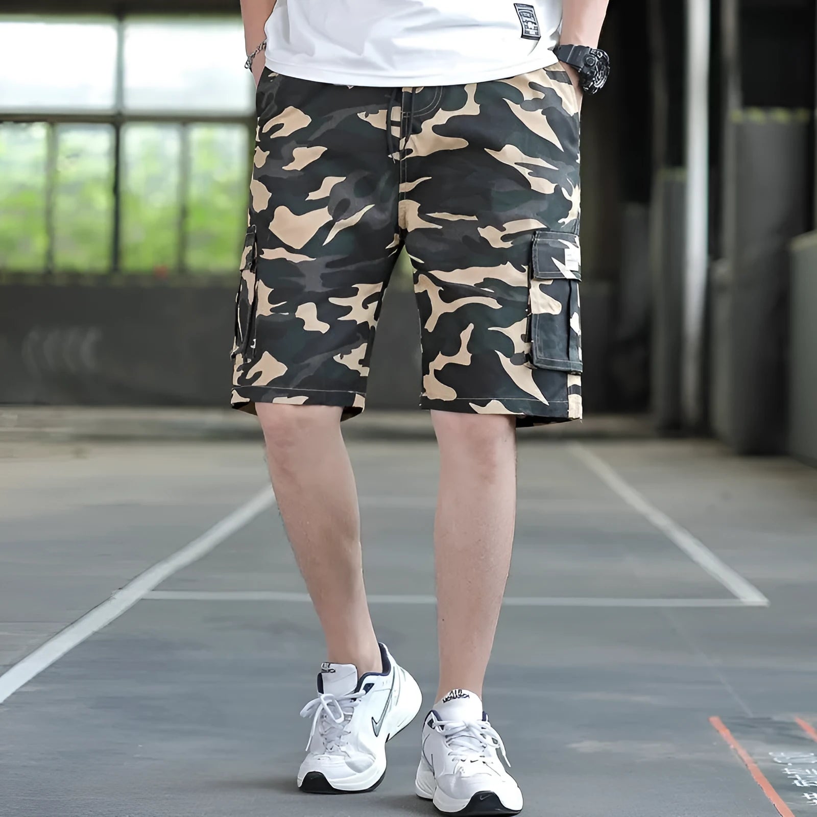 Man modelling loose fit khaki casual trousers with a giraffe pattern gradient detail.