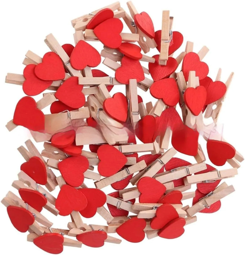 Set of five handmade solid wood heart-shaped clips in red, pink, white, yellow, and rose colours.