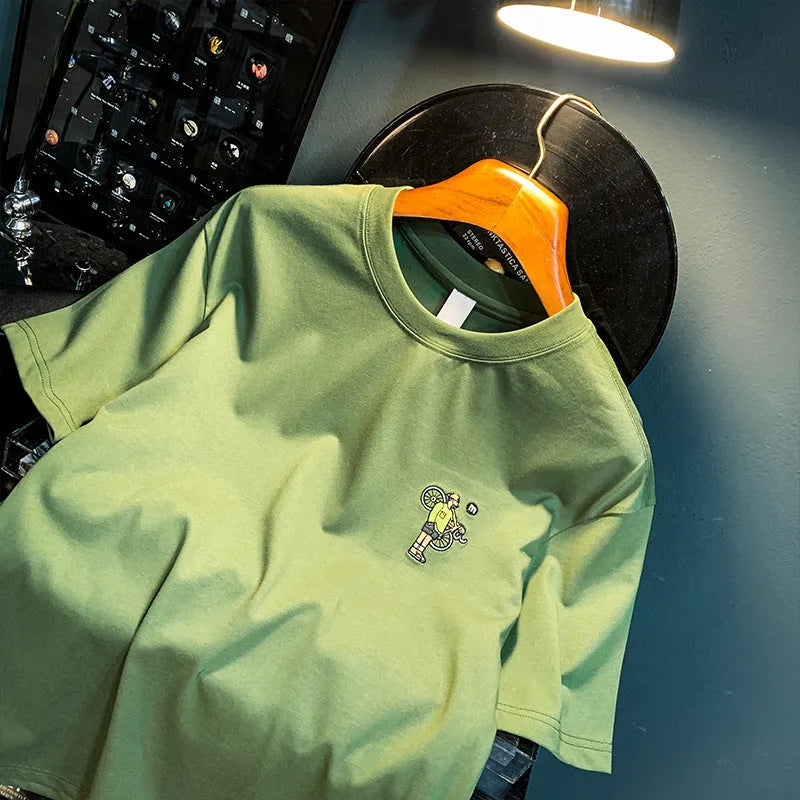 Green printed men's T-shirt with loose fit short sleeves displayed in multiple size options
