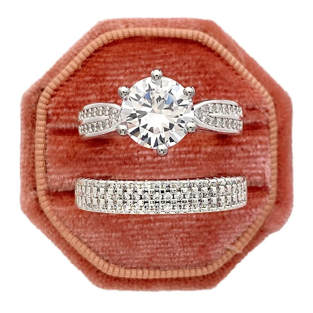 White gold alloy combined ring bracelet with round geometry design on finger.