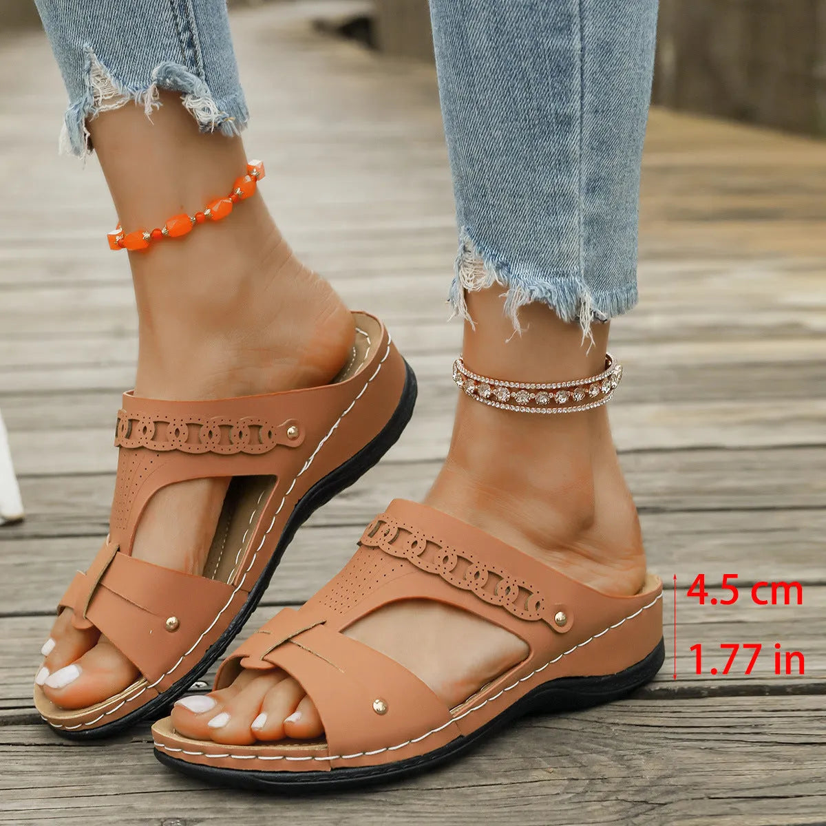 Pair of casual Roman style slippers with a fish mouth toe holder and slope heel, shown in a choice of colours.