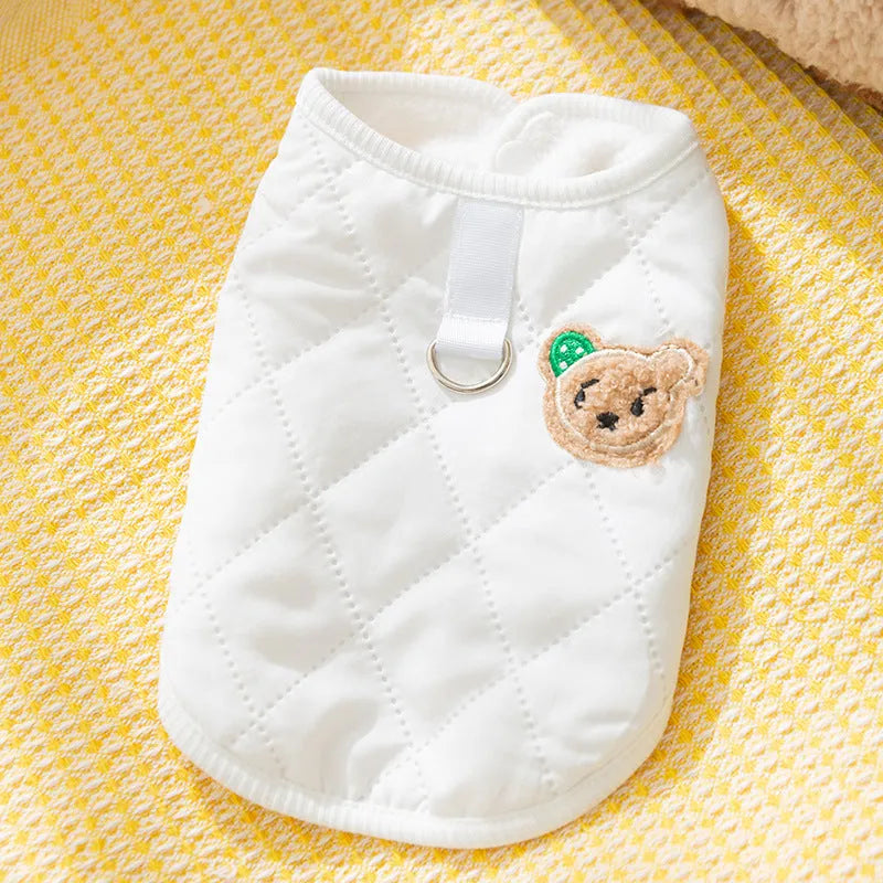 Quilted pet vest with bear patch embroidery on cream background for small dogs