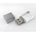 DIY luminous creative crystal USB 2.0 flash drive in mini car shape with transparent shell on a dark surface