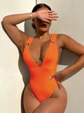 Women's solid colour one-piece swimsuit in spandex, shown in black, white, green, and orange.