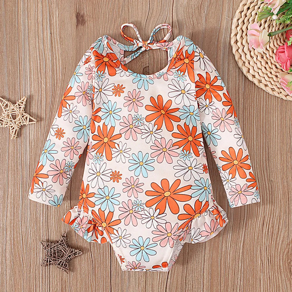 Girl's white floral print open back swimsuit with crew neck design and high-cut briefs