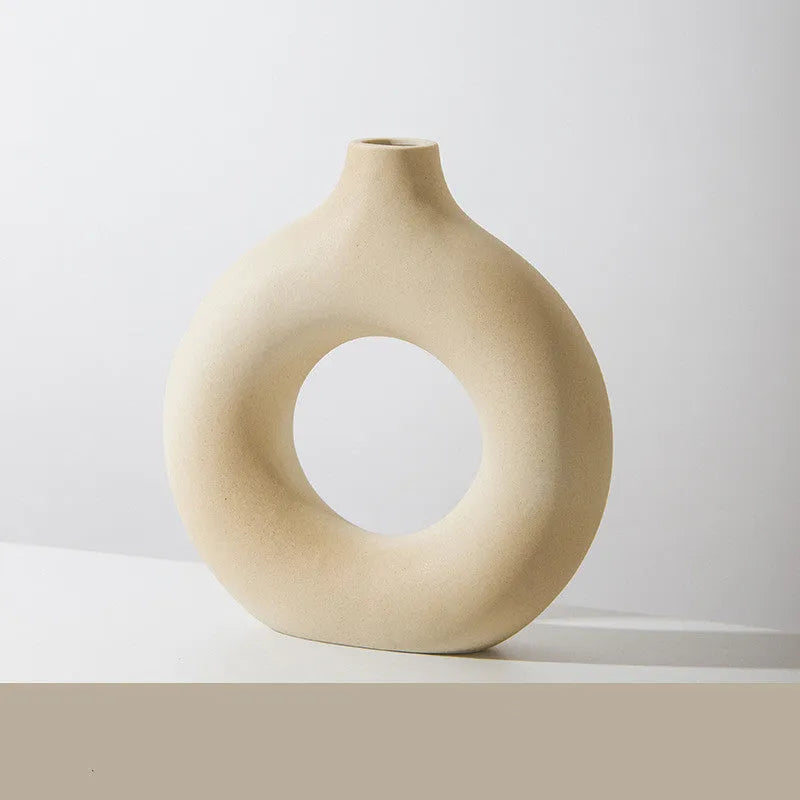 A simple modern frosted porcelain biscuit vase for flower arranging, shown in a neutral colour.