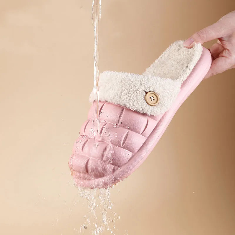 Women's pink detachable plush EVA winter house slippers with non-slip sole shown from the side.