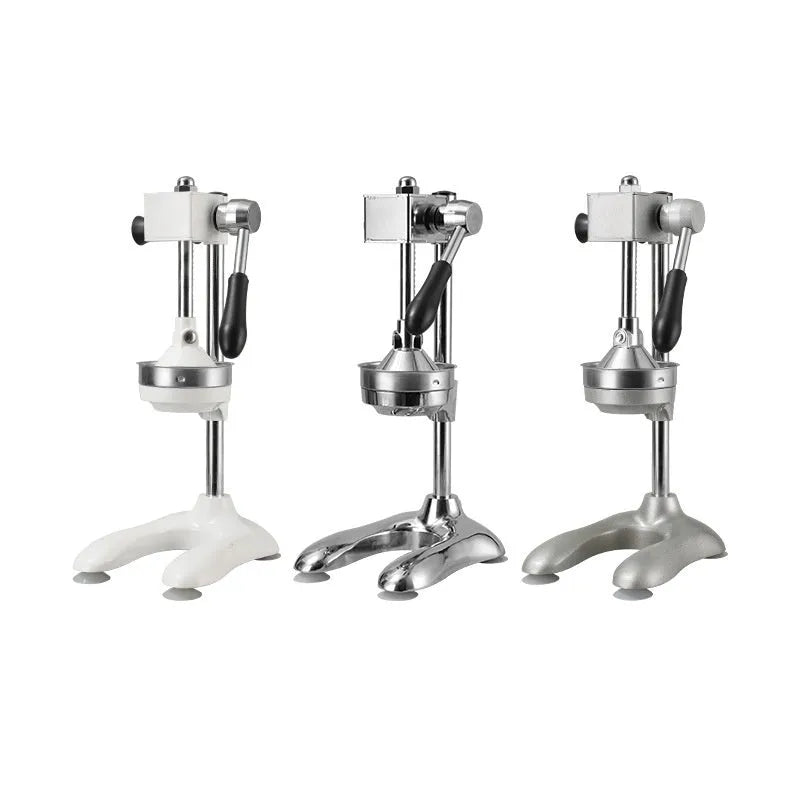 Vertical stainless steel manual citrus juicer on a kitchen counter showing different head type options.
