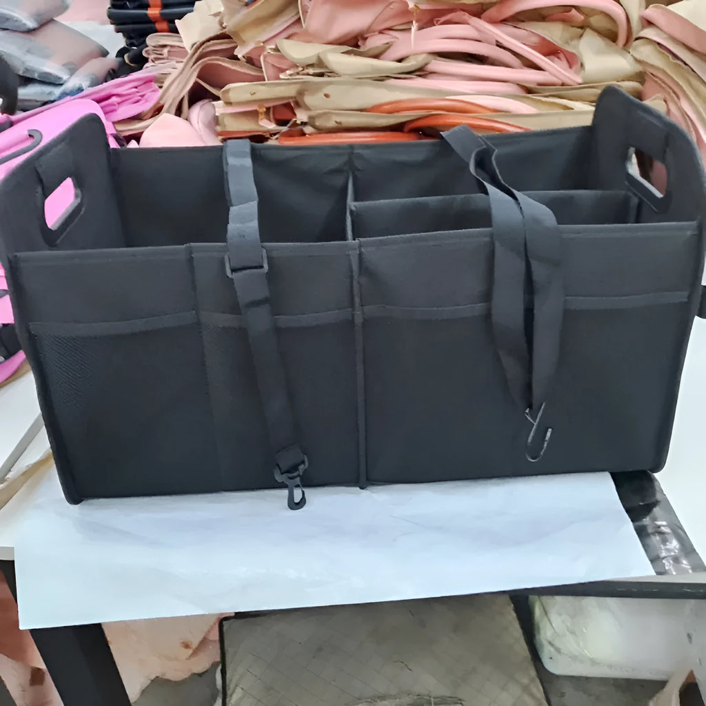 Foldable black car boot storage box with compartments and carry handle showing 56x32x32 cm dimensions