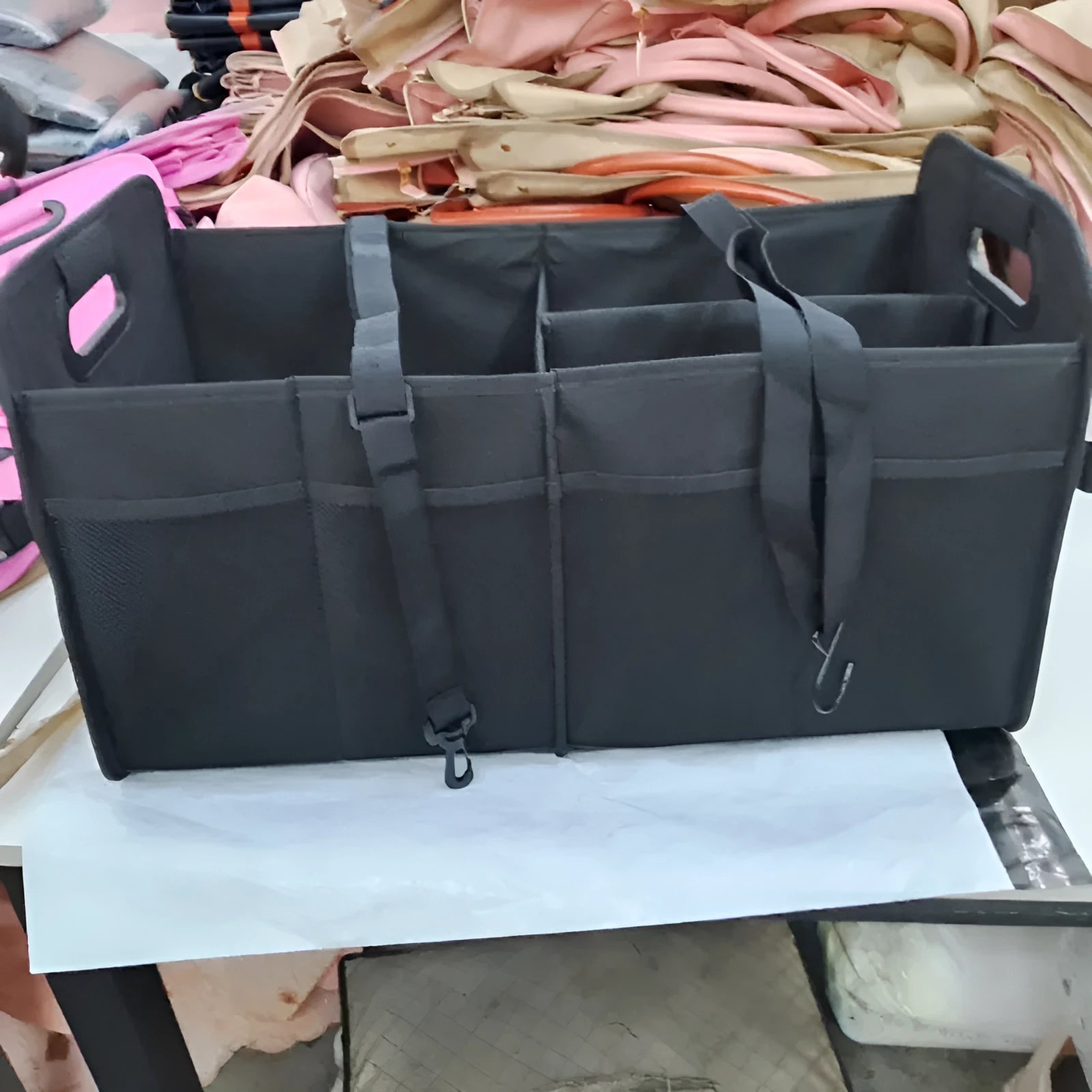 Foldable black car boot storage box with compartments and carry handle showing 56x32x32 cm dimensions
