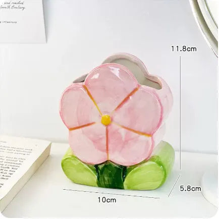 Ceramic flower pen holder storage box in a floral design on a desk