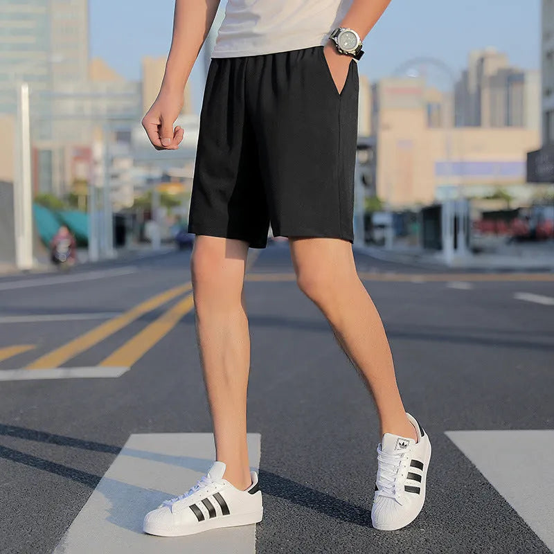 Men's quick-dry cotton five-point sports shorts in grey, black, and blue with elastic waist and drawstring, sizes L to 10XL